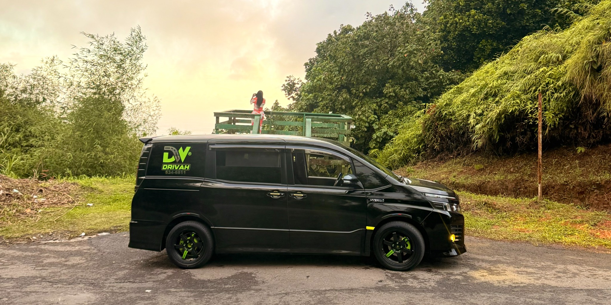 Black branded Drivah Toyota Voxy on Grenada road